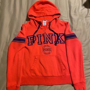 Pink hooded half zip. Size Medium. Orange and blue.